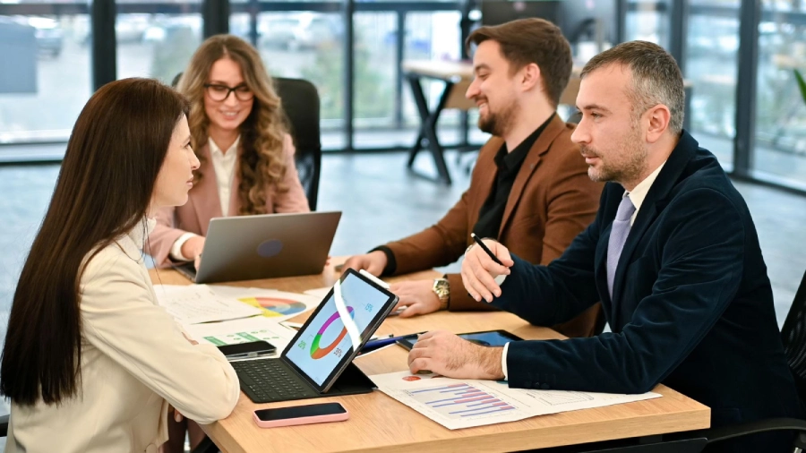 Healthcare professionals reviewing revenue reports together